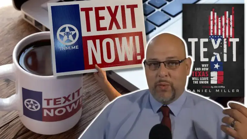 A man speaks to the camera beside a TEXIT Now mug, a 'TEXIT Now!' sign and the book 'TEXIT.'