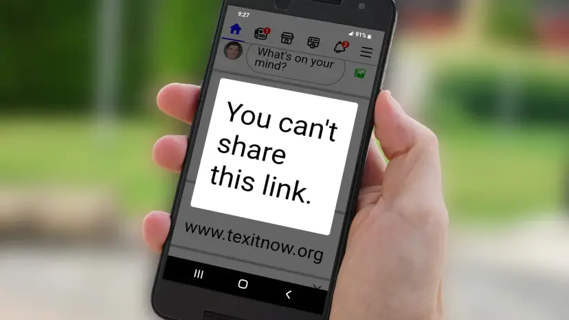 A hand holding a phone that displays the message 'You can't share this link' above www.texitnow.org.