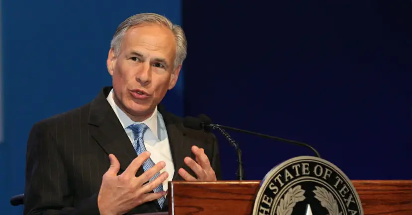 Governor Greg Abbott speaking at a podium bearing the State of Texas seal.