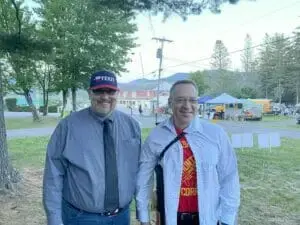 Daniel Miller with New Hampshire State Representative Michael Yakubovich outdoors at a summer event
