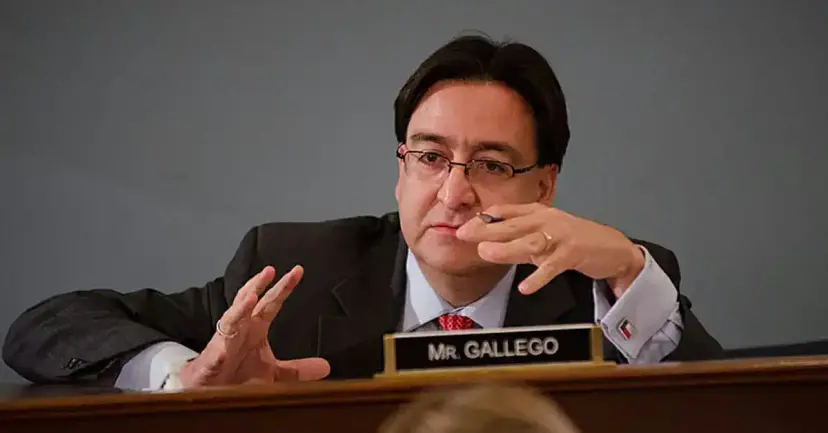 Pete Gallego seated at a hearing desk behind a nameplate reading "Mr. Gallego."