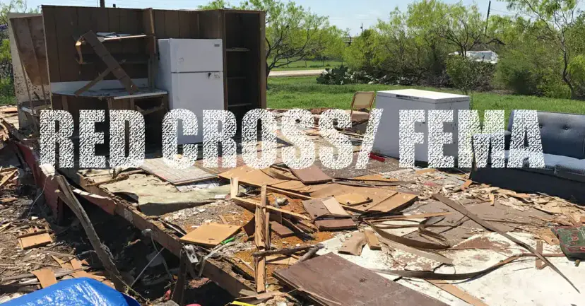 The words 'Red Cross/FEMA' over the wreckage of a destroyed home, with a refrigerator and couch in the debris.