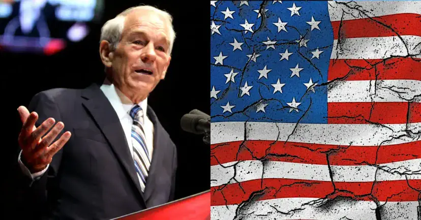 An older man in a suit speaking at a podium beside a cracked American flag graphic