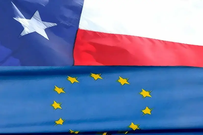Texas flag waving above the blue European Union flag with its circle of gold stars.