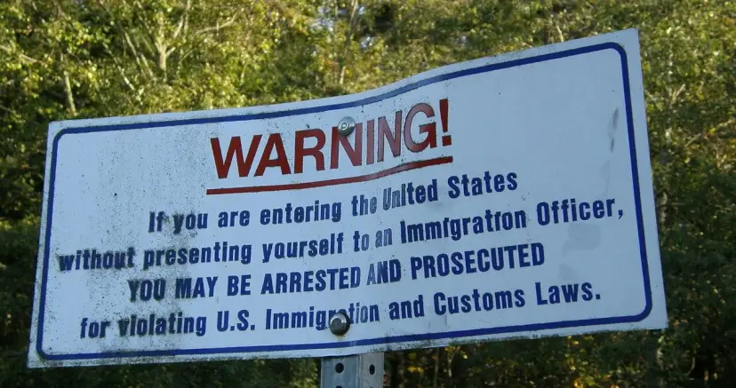 A sign at the international boundary between Canada and the United States in Point Roberts, Washington.