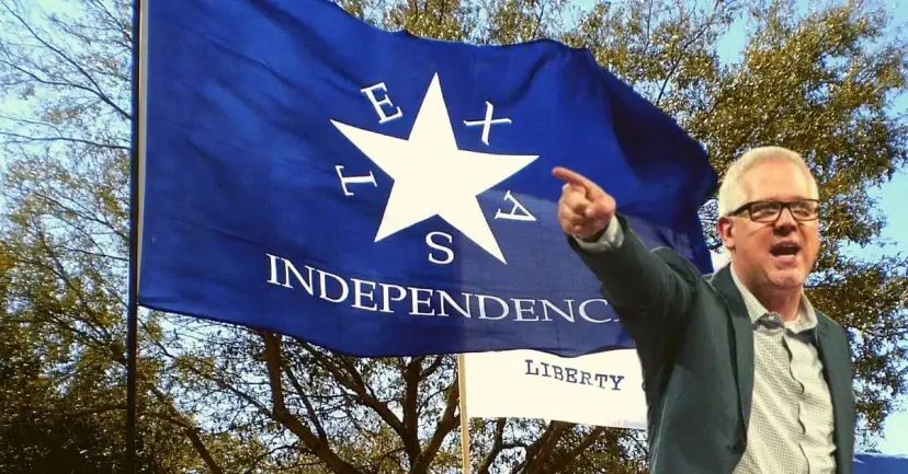Glenn Beck points and shouts in front of a blue 'Texas Independence' flag.