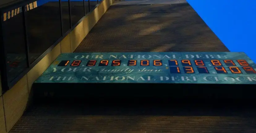 The National Debt Clock on a building wall displaying the running total of federal debt.