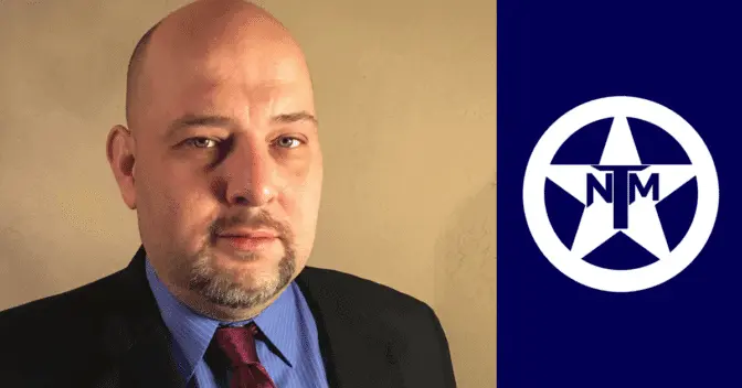 Portrait of a bald man with a goatee in a suit and red tie beside the TNM star logo.