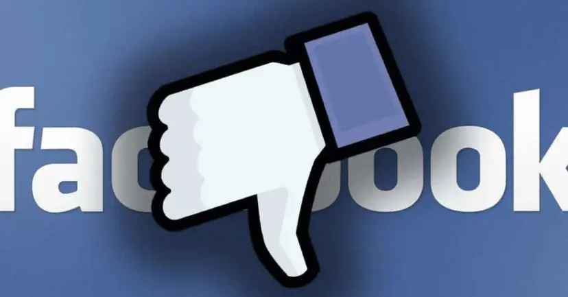 The Facebook wordmark partly covered by a large thumbs down icon.