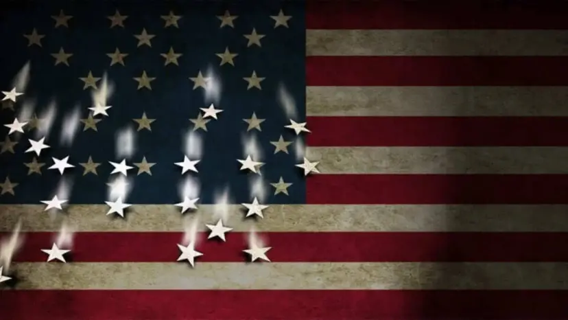 American flag with many of its white stars falling out of the blue field.