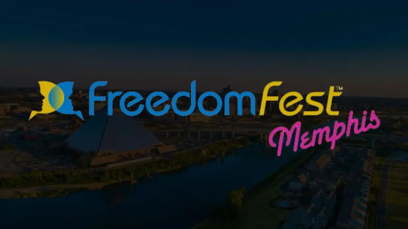 FreedomFest Memphis logo over a dark aerial view of the Memphis riverfront and pyramid