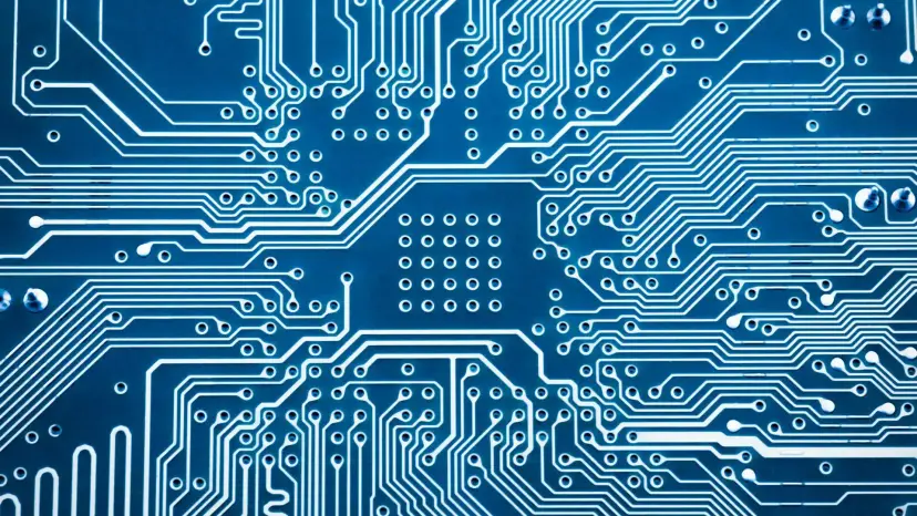 A blue circuit board pattern of copper traces and connection points.