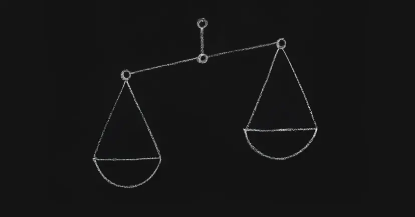 A chalk drawing of a balance scale tipped to one side on a blackboard.