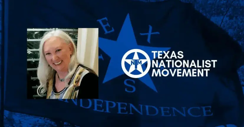 Photo of Susan Williamson smiling beside the Texas Nationalist Movement logo on a blue flag.