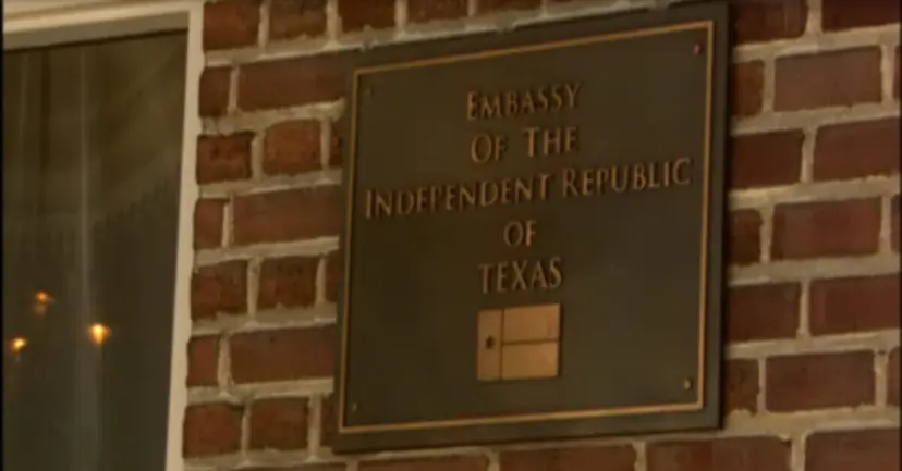 Bronze plaque on a brick wall reading 'Embassy of the Independent Republic of Texas.'
