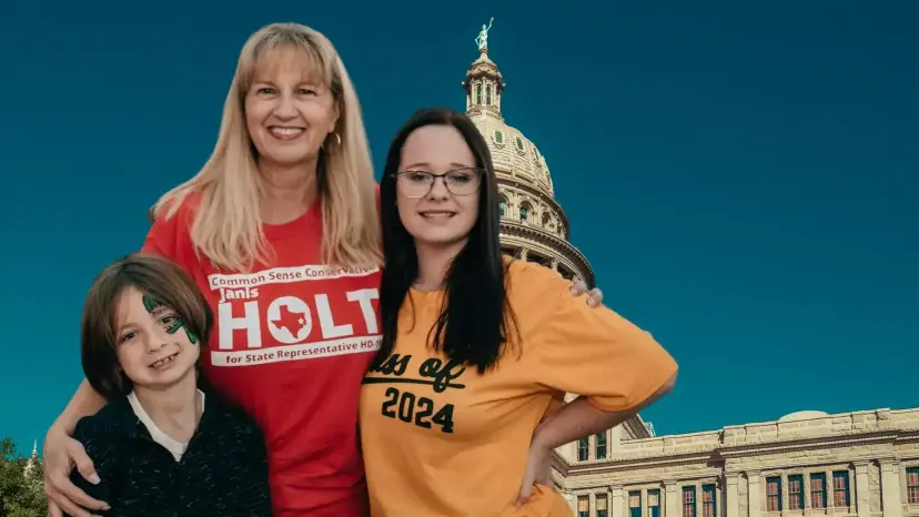 Janis Holt in a red campaign T-shirt with a child and a young woman in front of the Texas Capitol.