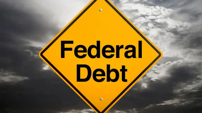 A yellow diamond road sign reading Federal Debt against dark storm clouds.