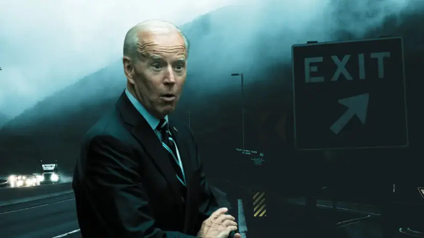 Joe Biden in a suit on a foggy highway beside a road sign reading 'Exit.'