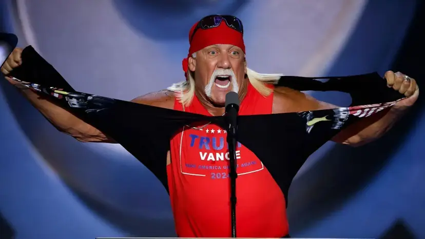 Hulk Hogan tearing open his shirt at a microphone to reveal a red 'Trump Vance 2024' tank top.