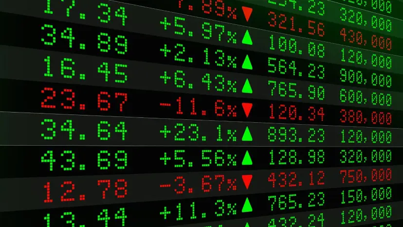 A stock market board showing prices and percentage changes in green and red digits.