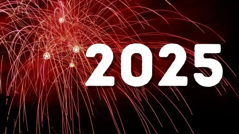 The year 2025 in large white numerals beside red fireworks bursting against a night sky.
