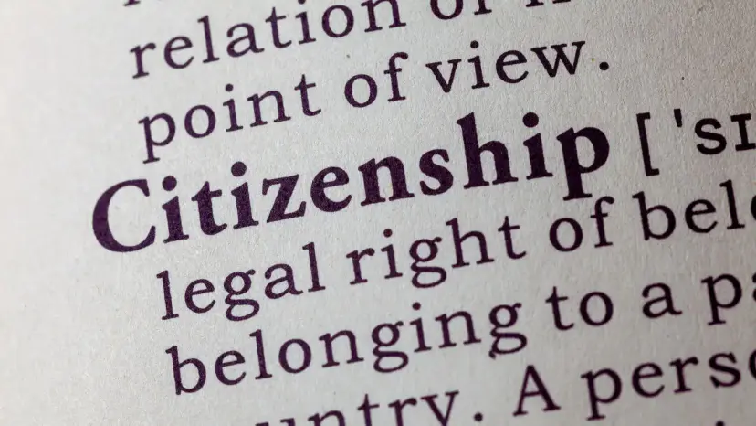 Close view of a printed dictionary entry for the word 'Citizenship' and its definition.