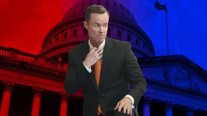 Dade Phelan tugging at his collar in front of the U.S. Capitol dome tinted red and blue.