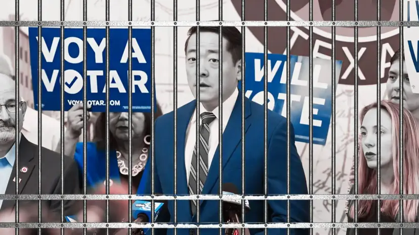 A man in a blue suit at a press conference behind jail bars, with 'Voy a Votar' signs.