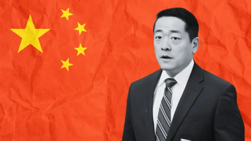 Gene Wu in a dark suit, shown in black and white against a crumpled Chinese flag.