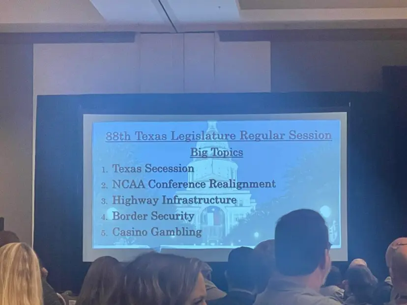 Presentation slide on big topics for the 88th Texas Legislature shown to a seated audience