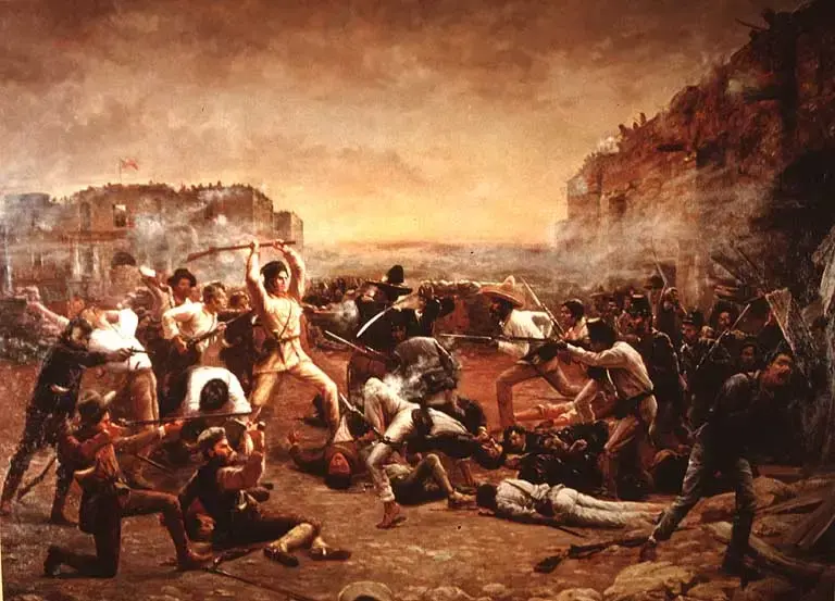 Painting of the Battle of the Alamo, with defenders fighting attacking soldiers amid smoke and fallen men.
