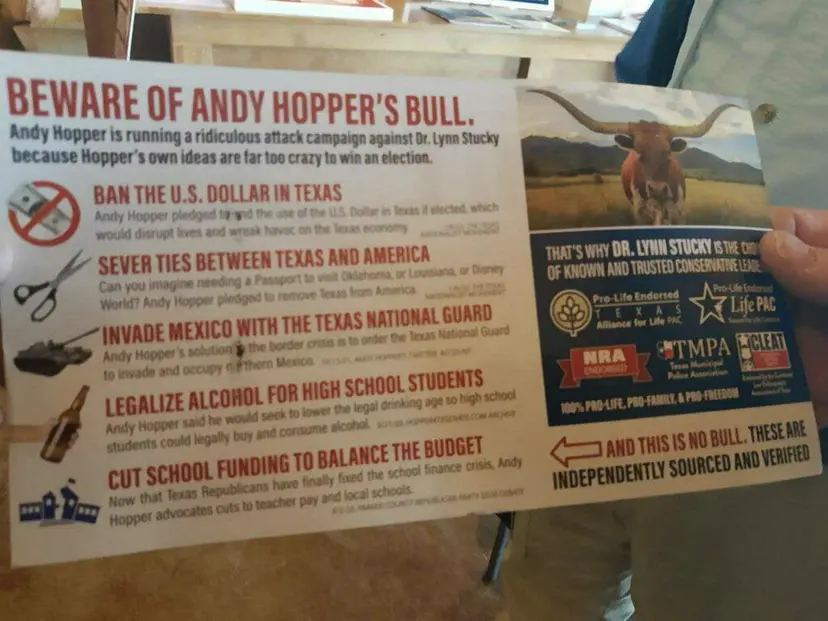 A hand holds a campaign mailer titled 'Beware of Andy Hopper's Bull' supporting Dr. Lynn Stucky.