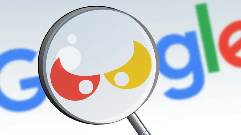 A magnifying glass enlarging the two red and yellow letters of the Google logo.