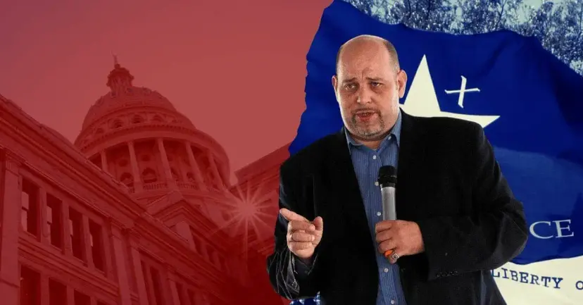 Daniel Miller speaks with a microphone in front of the Texas Capitol and a Texas Independence flag.