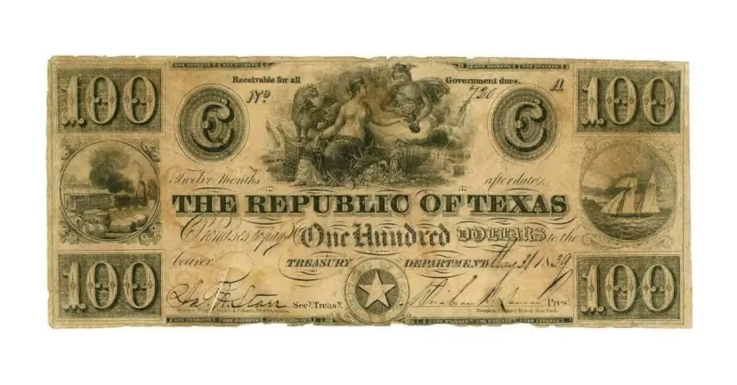 Worn one hundred dollar Republic of Texas banknote with ornate engravings, a ship, and a train.