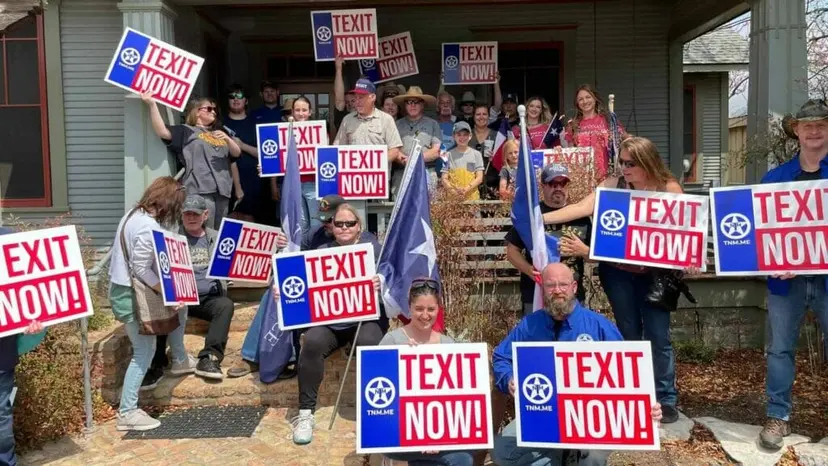 Crowd of supporters on a house porch holding red, white and blue 'TEXIT Now!' signs and flags.
