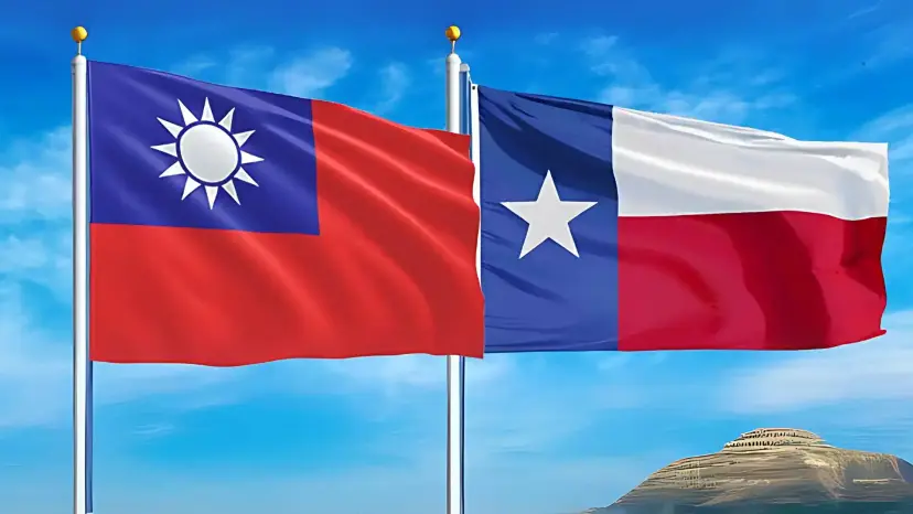 The flag of Taiwan and the Texas flag flying side by side against a blue sky.