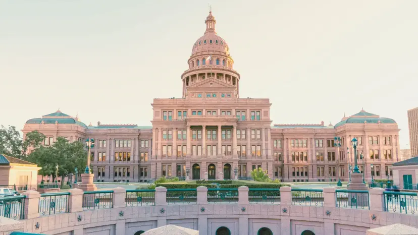 The Texas Capitol building in Austin viewed from the north in soft evening light.