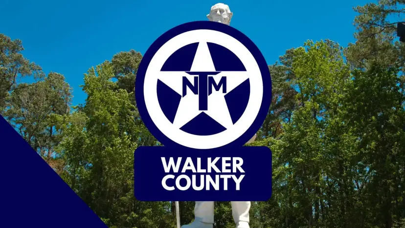 TNM star logo reading 'Walker County' in front of a tall white statue and pine trees.
