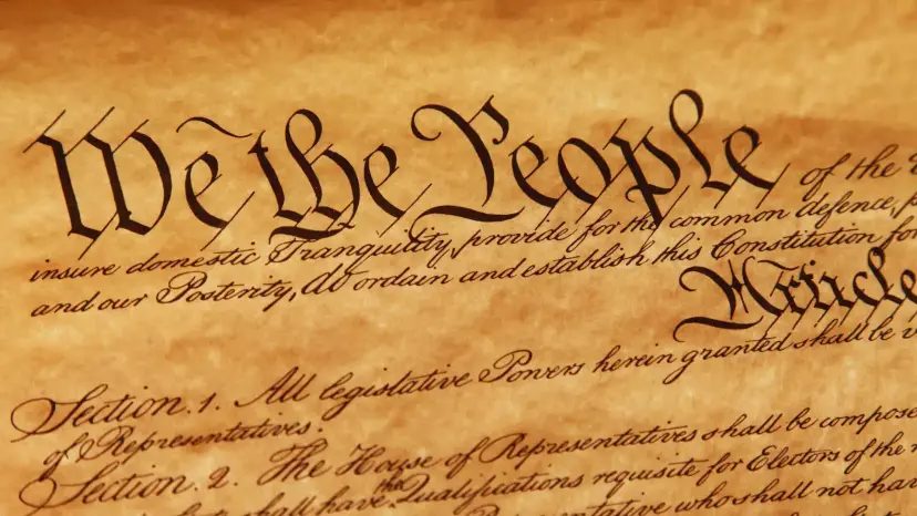 Close-up of the handwritten preamble of the U.S. Constitution, opening with the words 'We the People.'