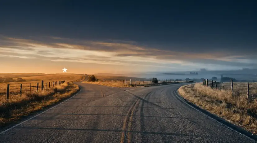 A rural road forking in two directions under a dusky sky, with a lone white star above the left path.