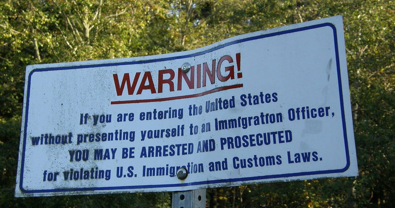 A sign at the international boundary between Canada and the United States in Point Roberts, Washington.