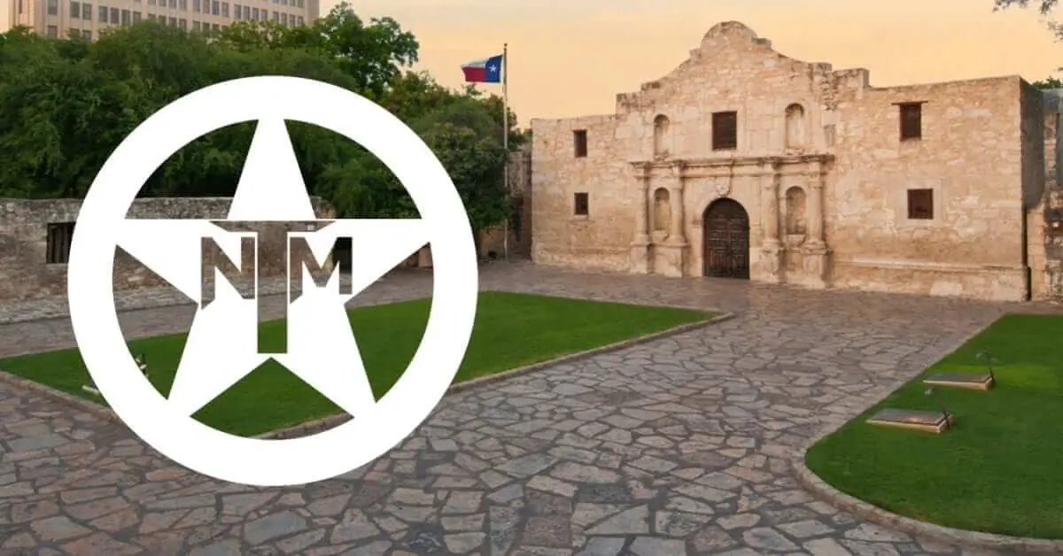 The Texas Nationalist Movement star logo in front of the Alamo church and its stone courtyard.