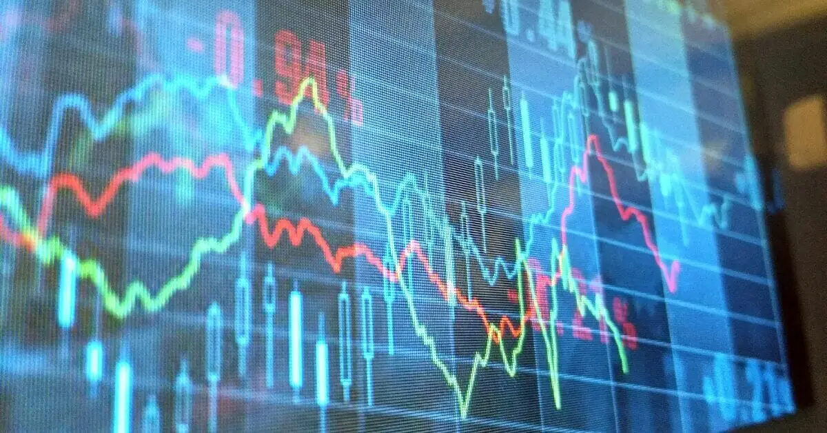 Stock market line and candlestick charts glowing on a trading screen.