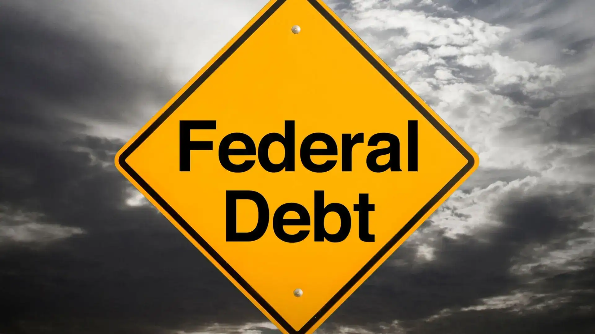 A yellow diamond road sign reading Federal Debt against dark storm clouds.
