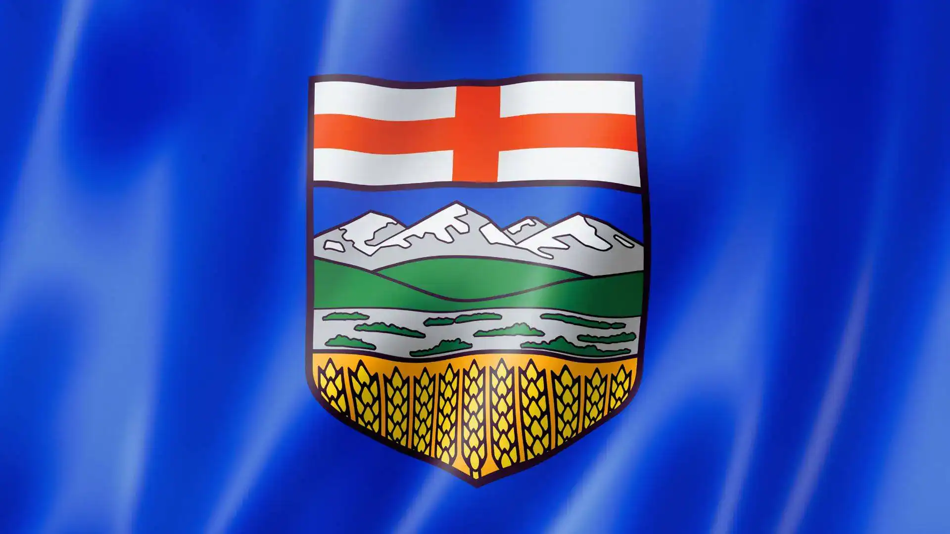 The Alberta provincial flag, a coat of arms with mountains and wheat on a waving blue field.