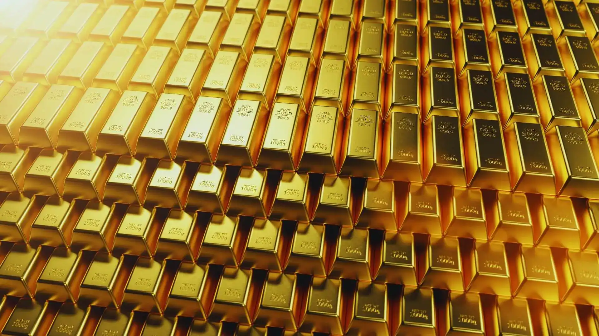Rows of stacked gold bars glowing under warm light.