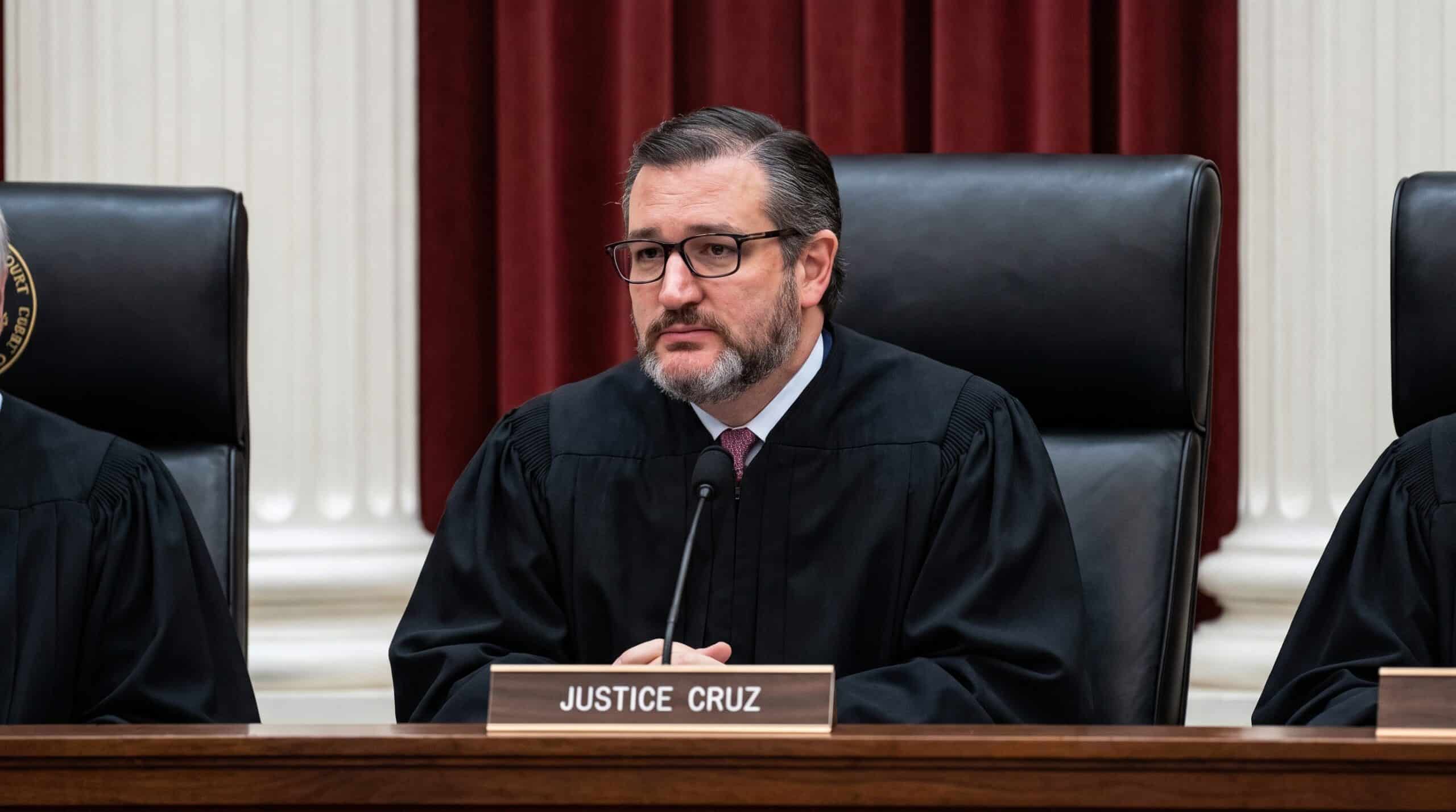 A bearded man with glasses in judicial robes seated at a bench behind a nameplate reading 'Justice Cruz.'